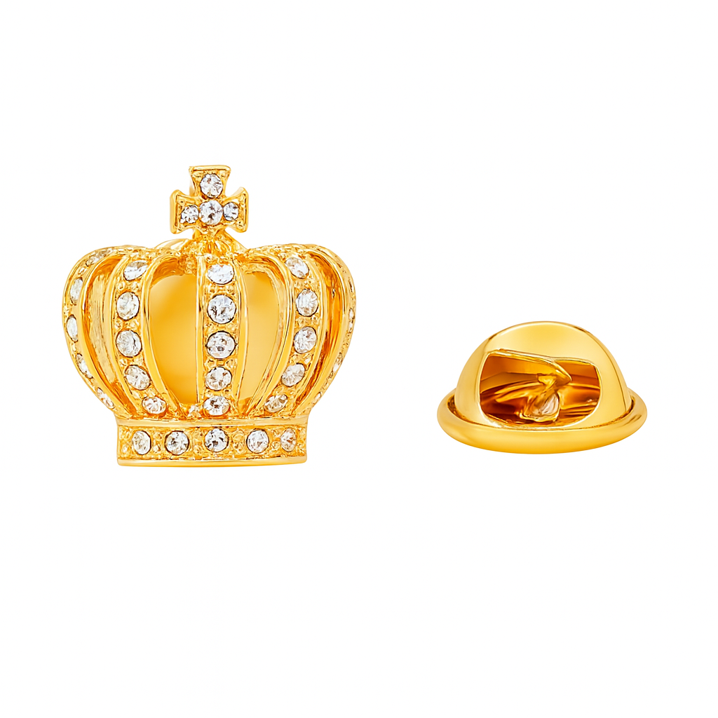Gold crown-shaped pin with gemstones on a white background