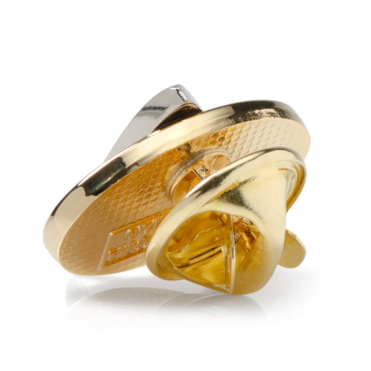 Gold and silver jewelry piece on a white background