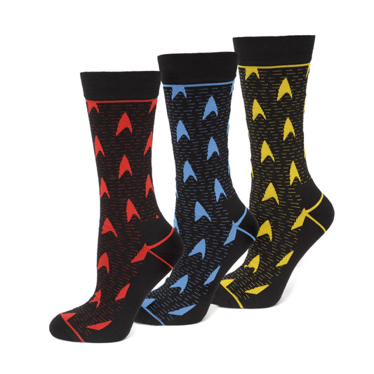Three pairs of socks with geometric pattern designs on a white background