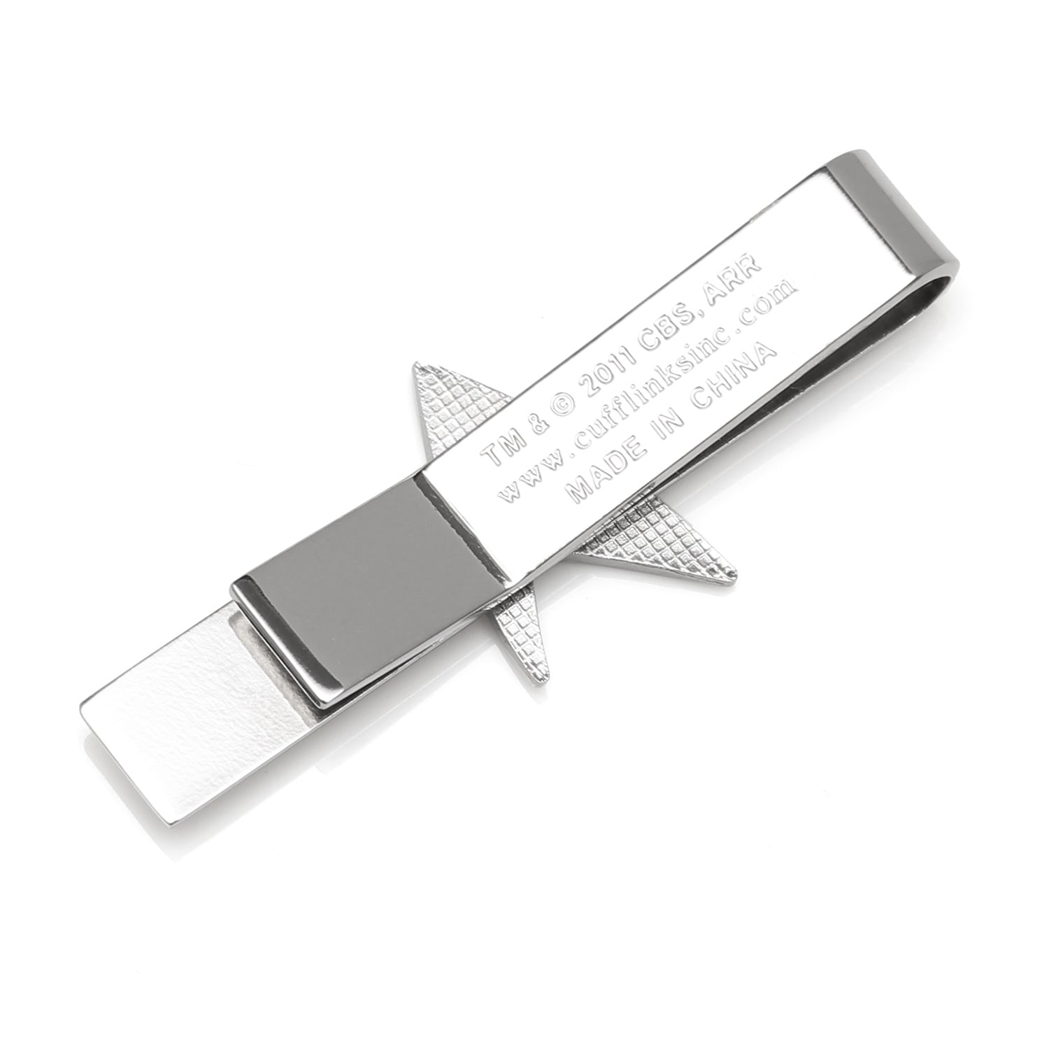 Silver shark-shaped money clip on a white background