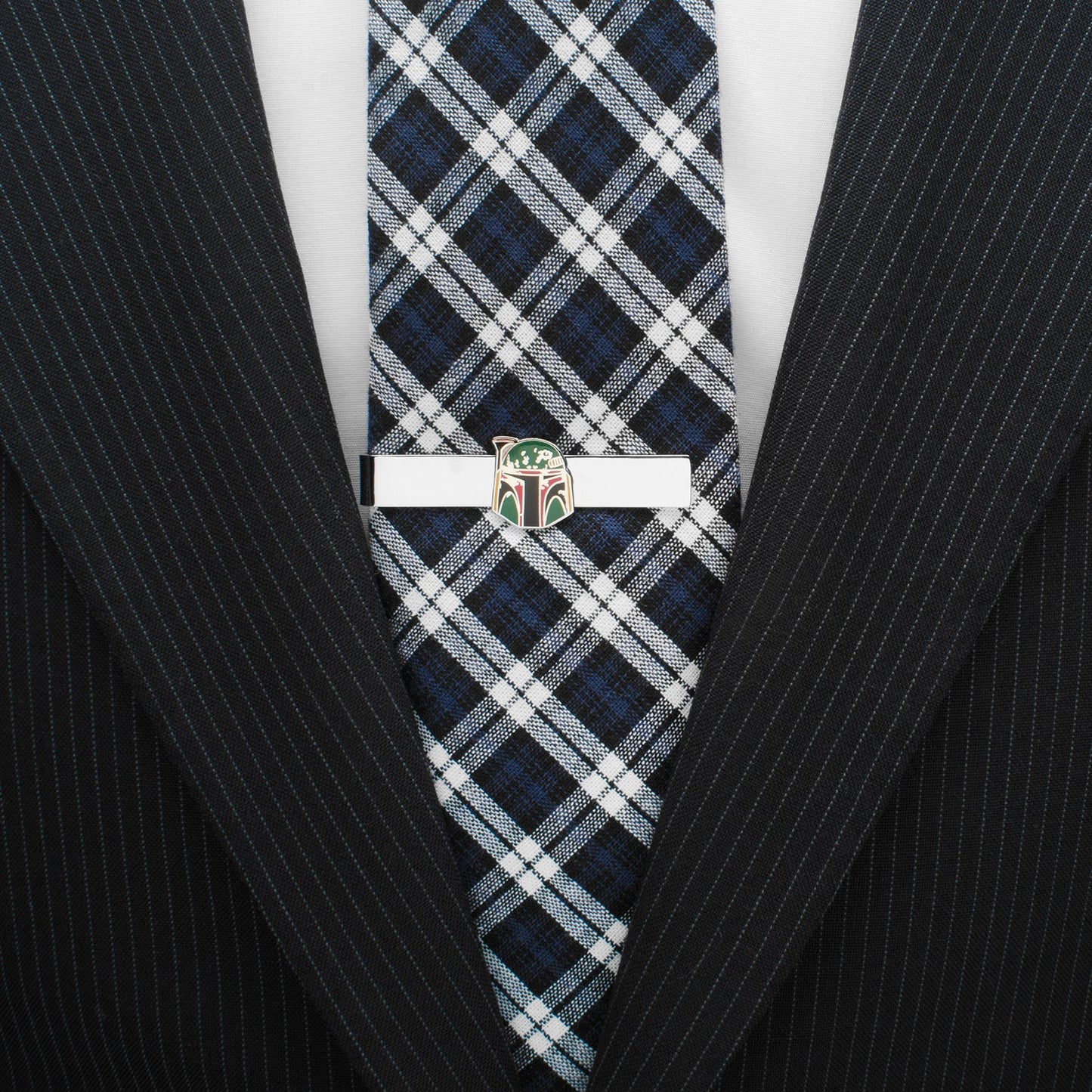 Plaid tie with a white clasp on a black pinstripe suit