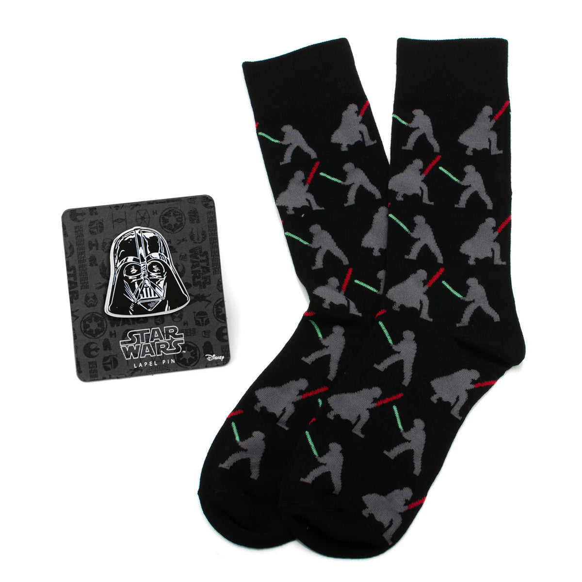Black socks with gray silhouettes of characters holding lightsabers and a Darth Vader lapel pin on a white background
