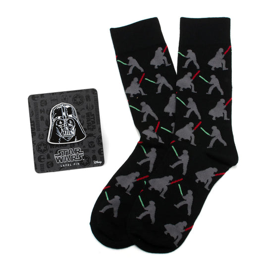 Black socks with gray silhouettes of characters holding lightsabers and a Darth Vader lapel pin on a white background