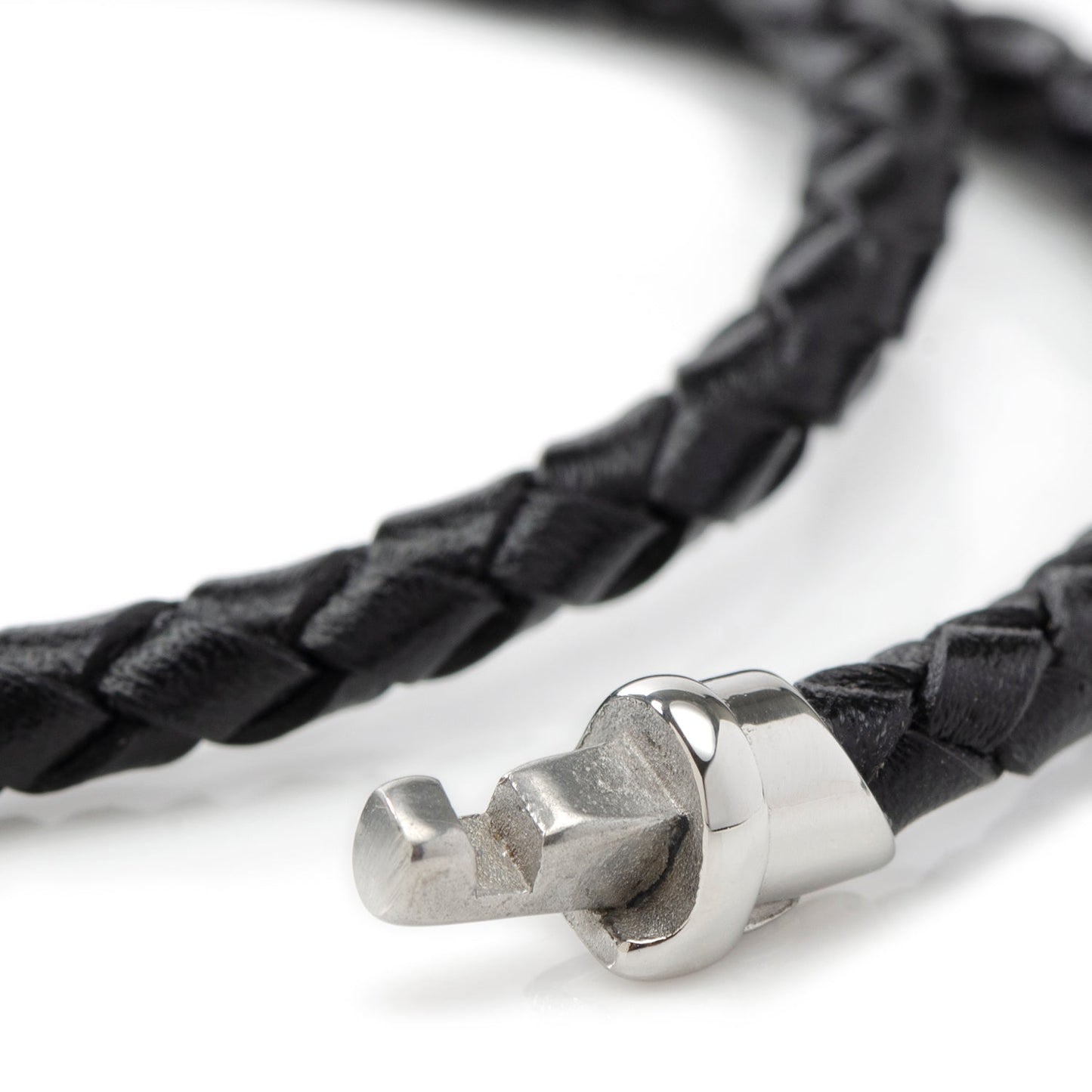 Black braided leather bracelet with a silver clasp on a white background