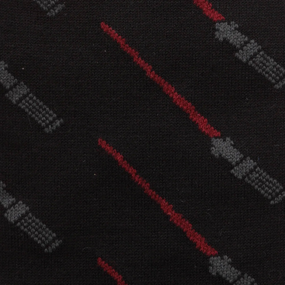 Black socks with red and gray laser sword designs on a black background