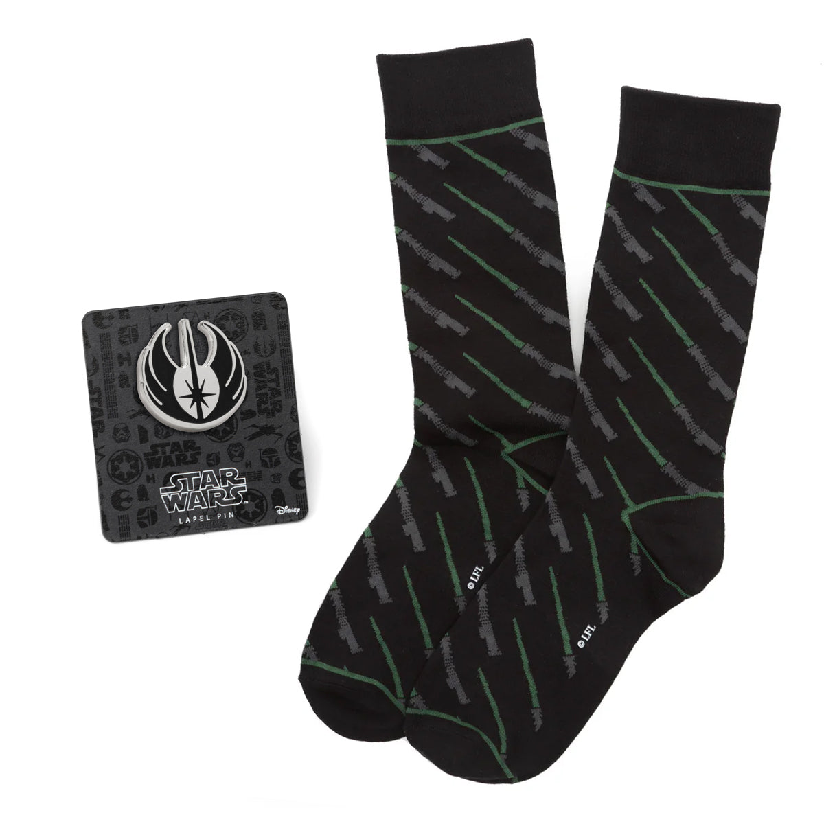 Black socks with green patterns and a Star Wars logo on a card.