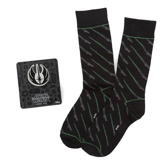 Black socks with green patterns and a Star Wars logo on a card.