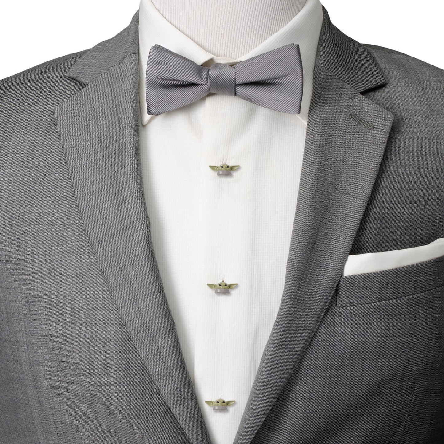 Gray suit jacket with a white dress shirt and gray bow tie on a mannequin.