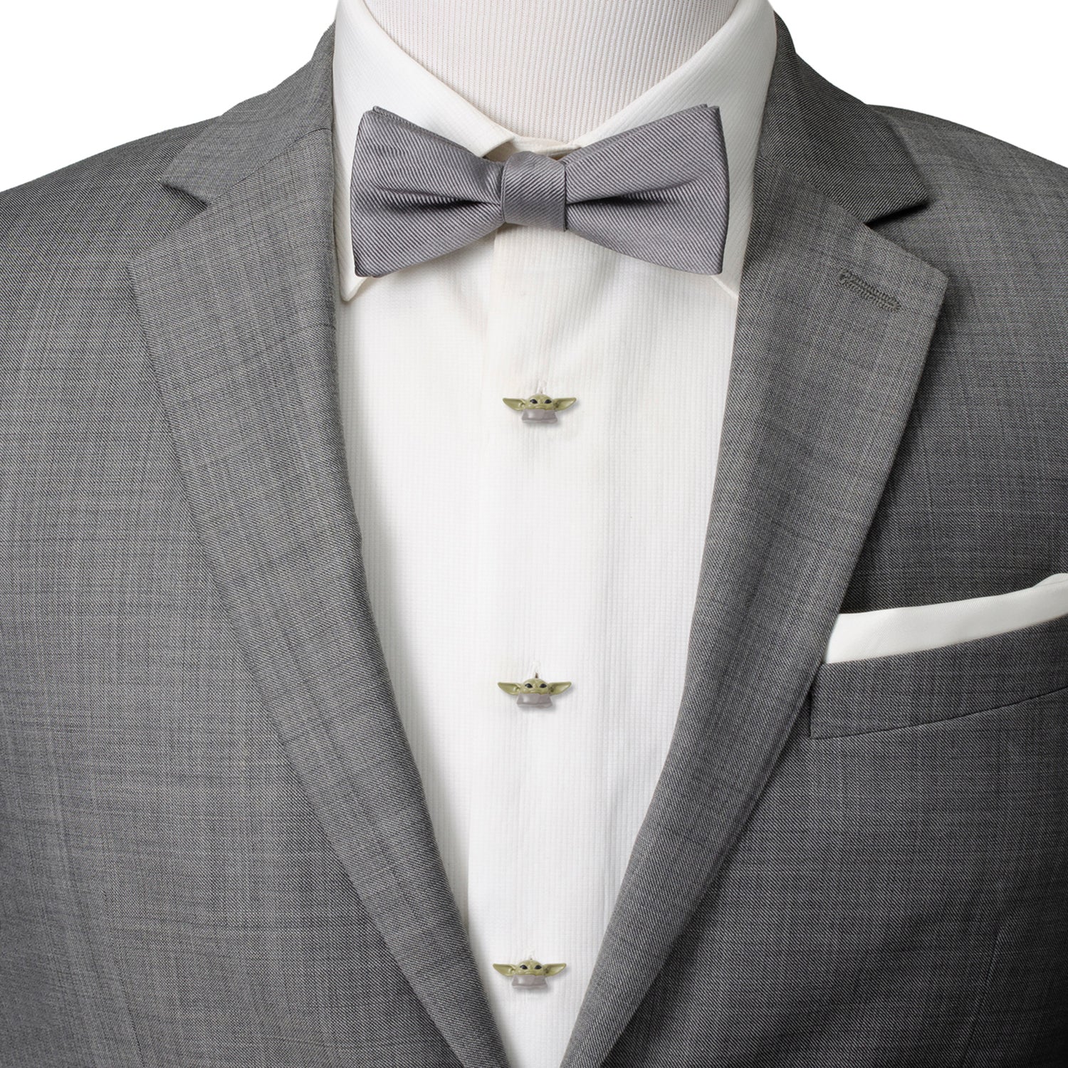 Gray suit jacket with a white dress shirt and gray bow tie on a mannequin.