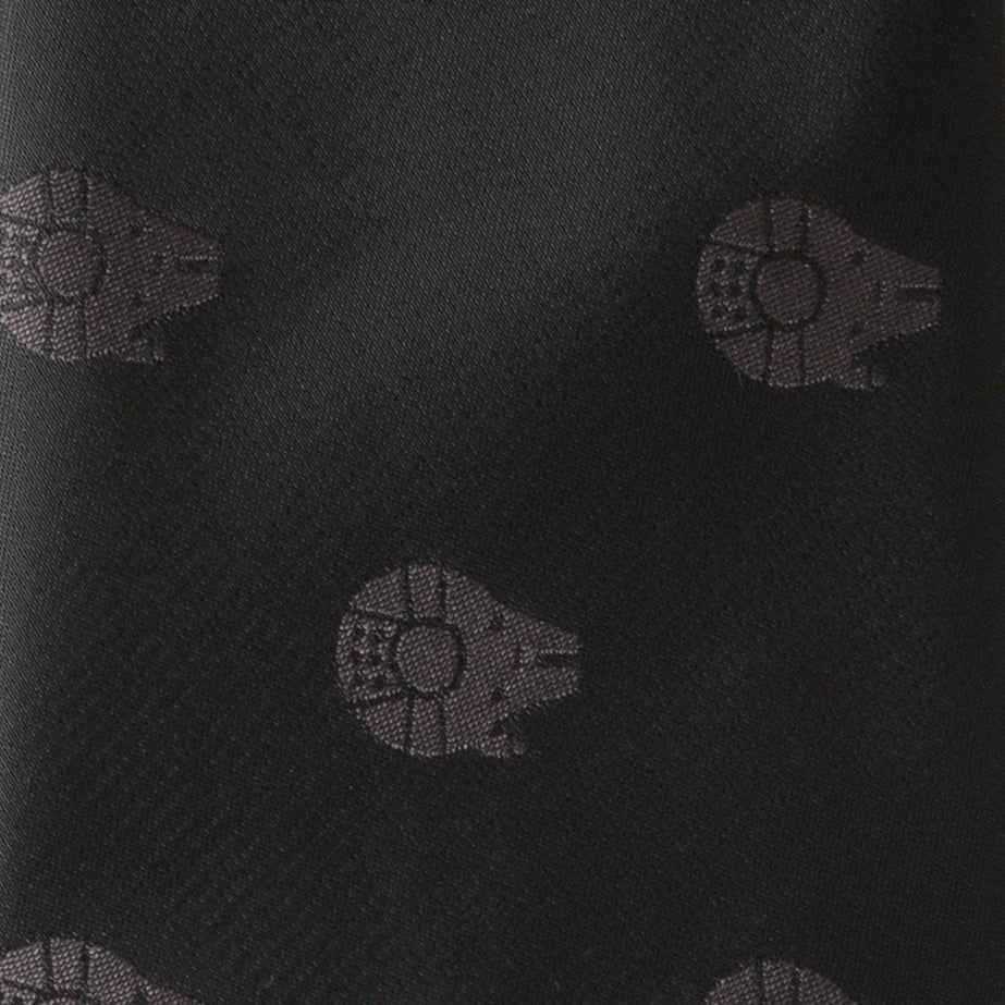 Black fabric with small starship patterns on a black background