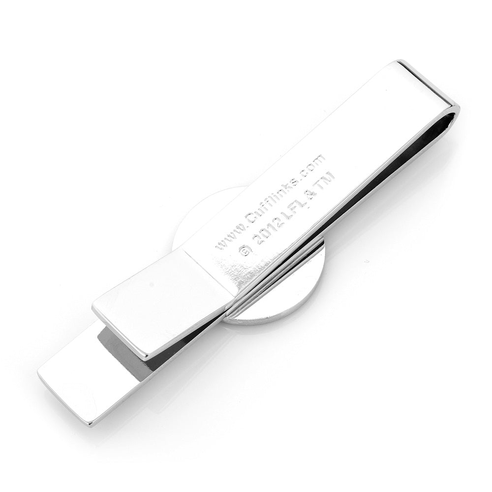 Metallic object with engraved text on a white background