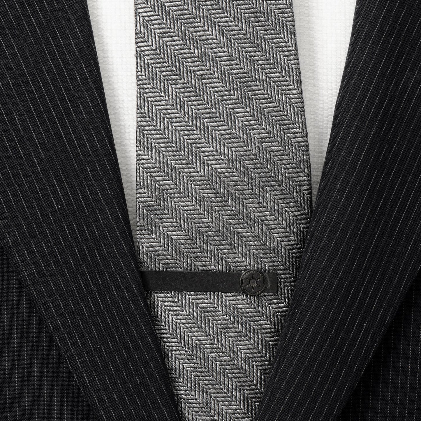 Gray herringbone tie with a black suit jacket