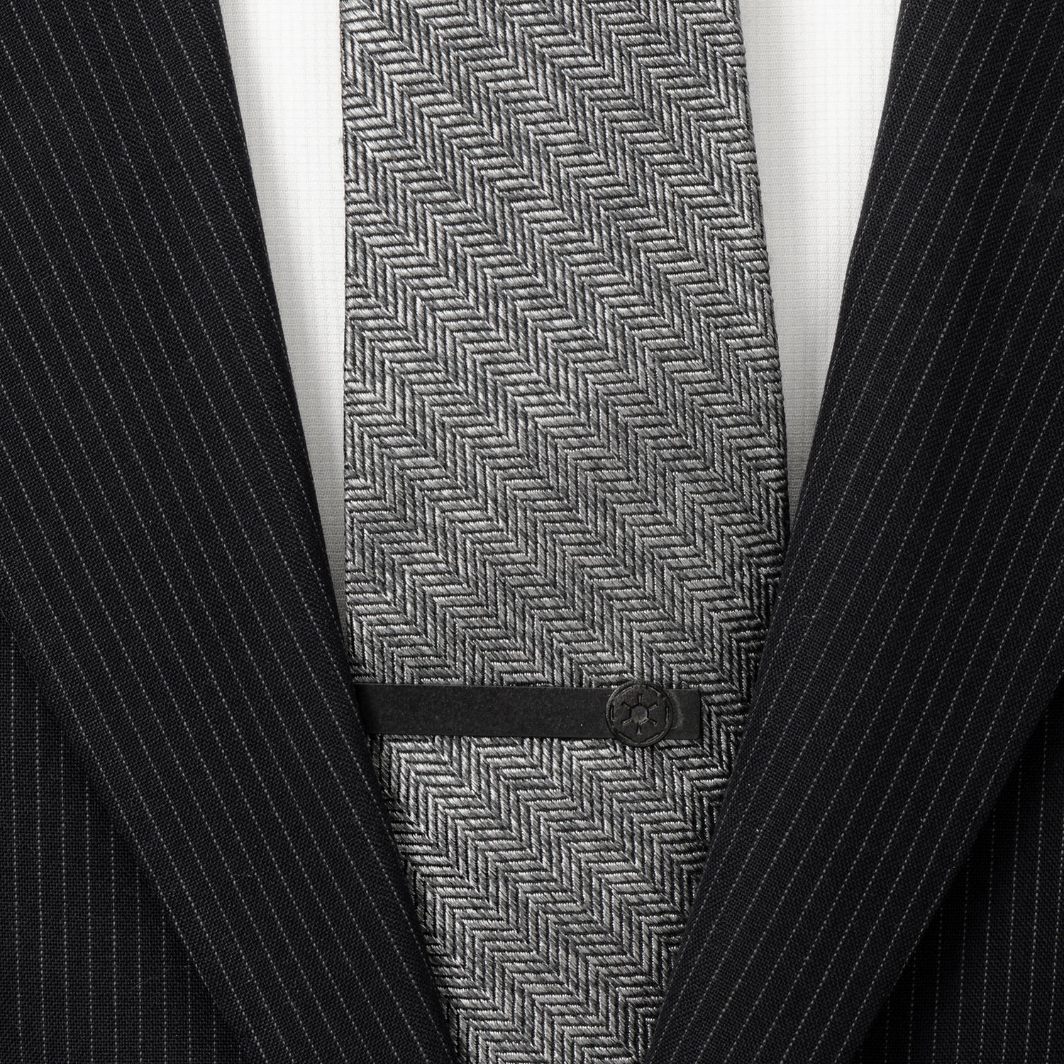 Gray herringbone tie with a black suit jacket