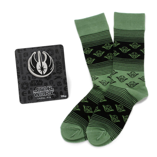 Green and black patterned socks with a Star Wars lapel pin on a white background