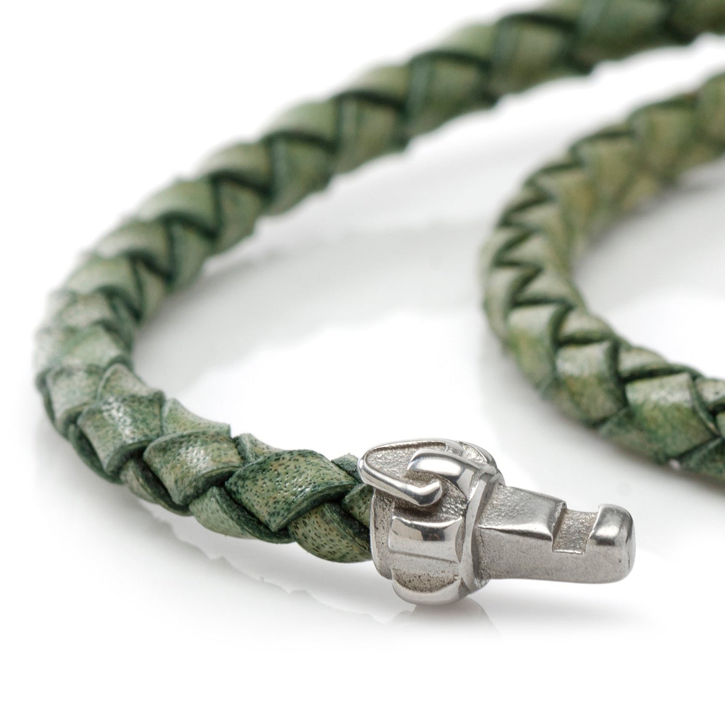 Green braided leather bracelet with a silver clasp on a white background