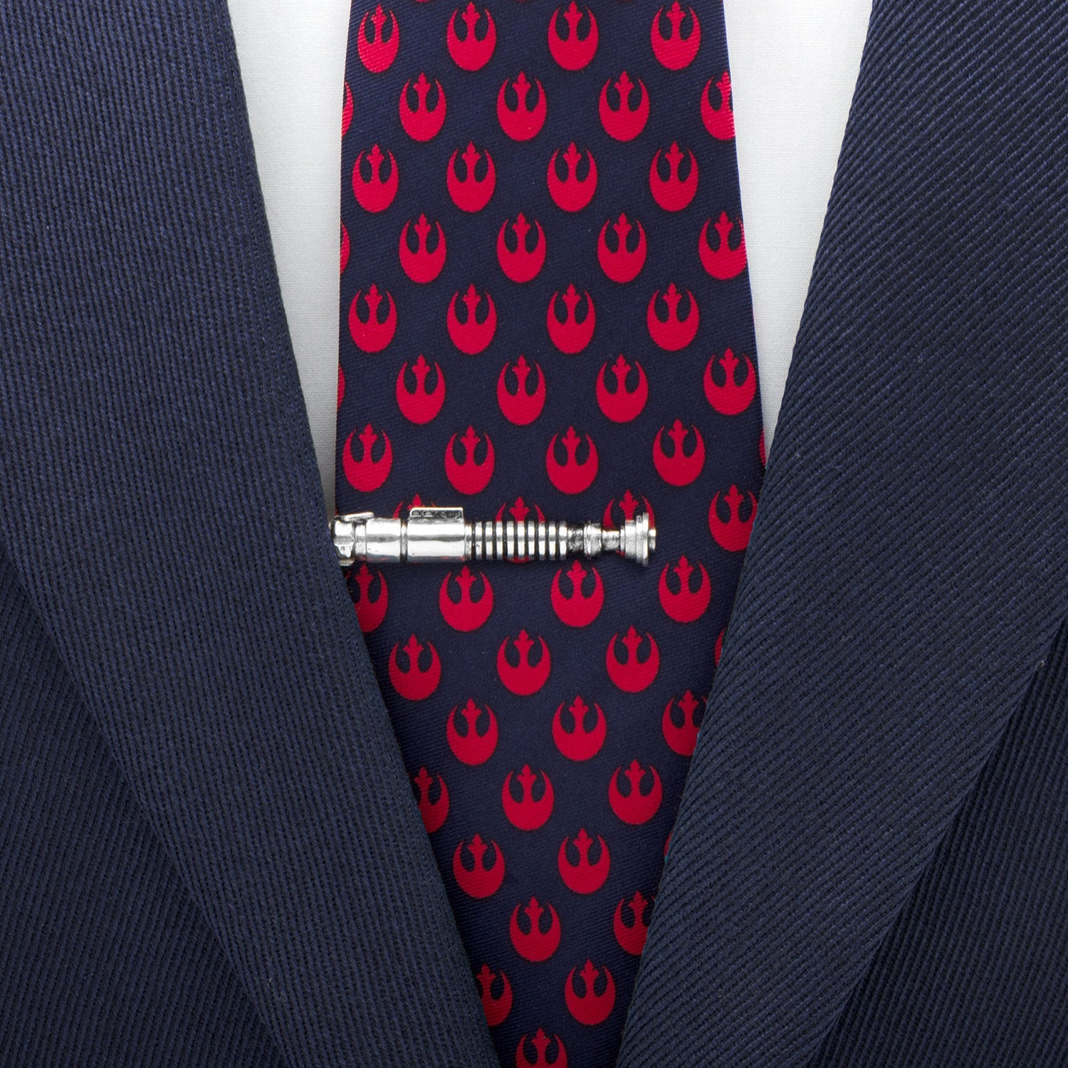 Navy tie with red Rebel Alliance symbols and a silver tie clip on a suit.
