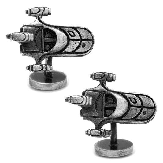 Pair of silver spaceship cufflinks on a white background