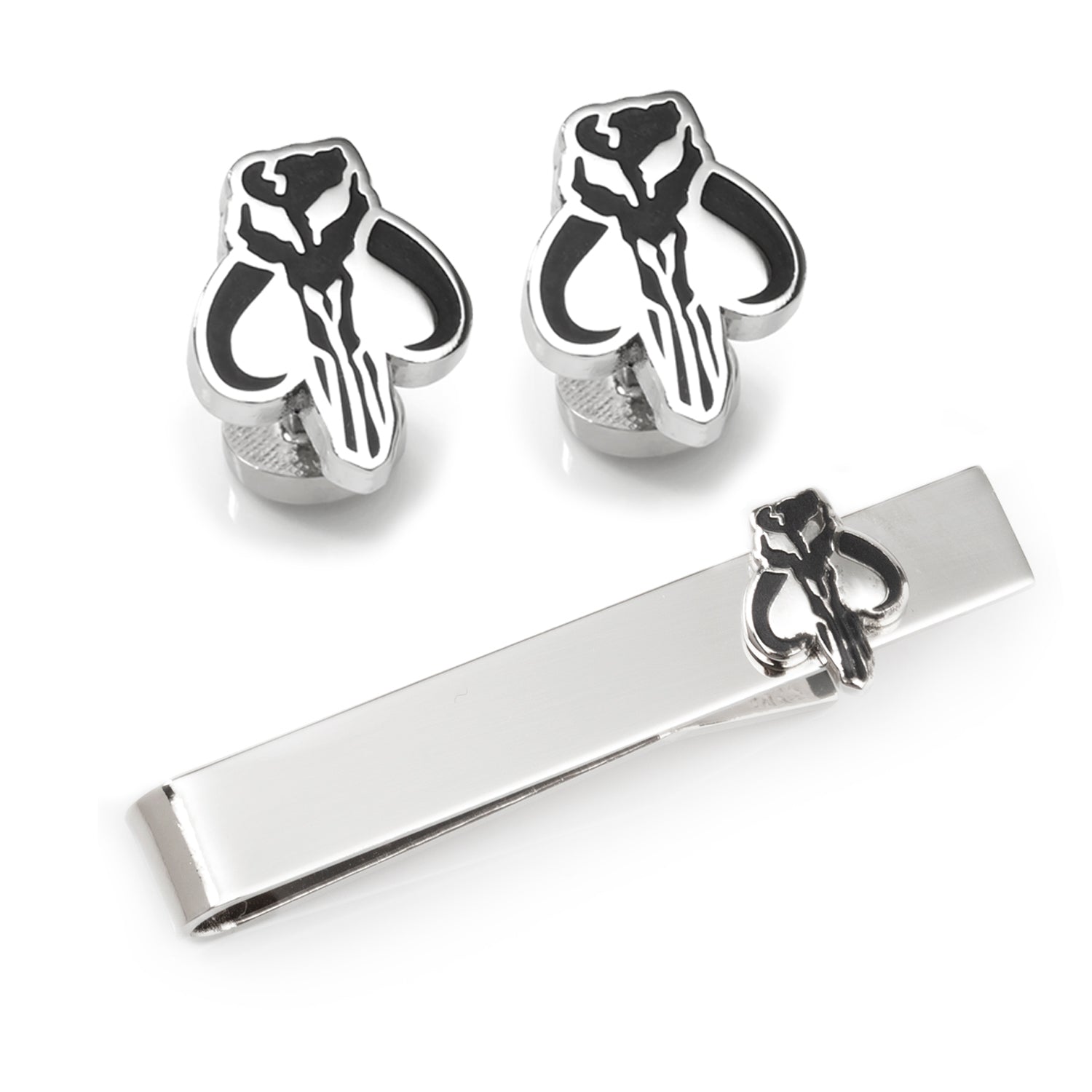 Silver skull-shaped cufflinks and tie clip on a white background