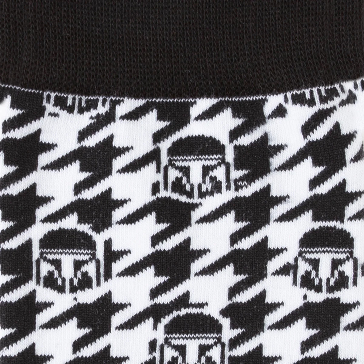 Close-up of a black and white patterned sock with elephant design.