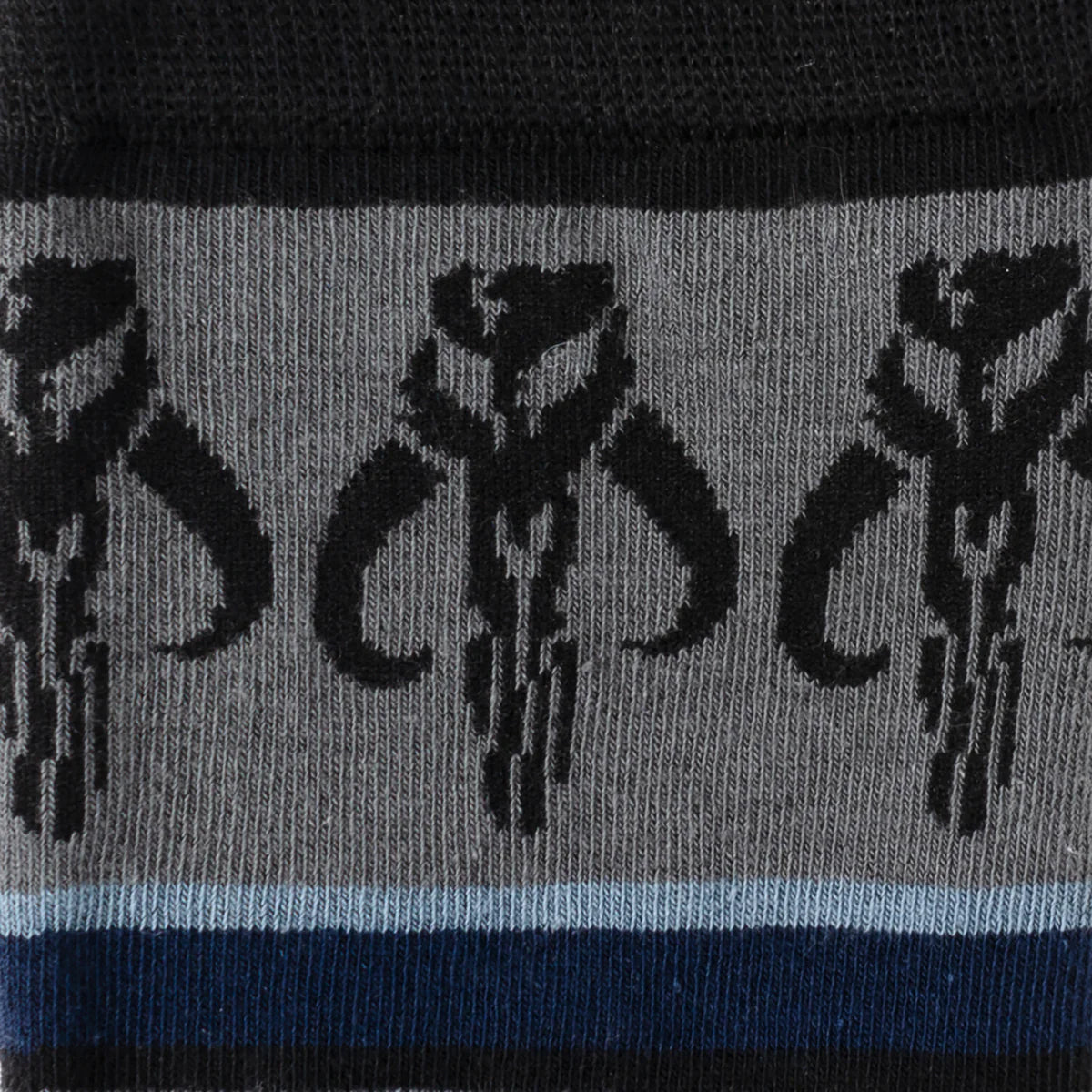 Close-up of a sock with black floral patterns on a gray background