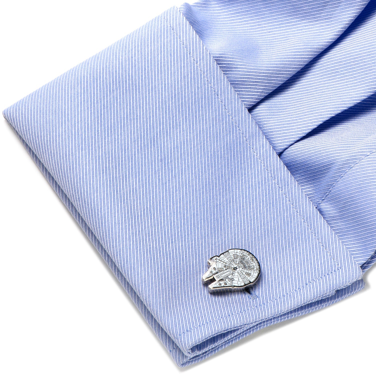 Cufflink on a light blue striped shirt cuff