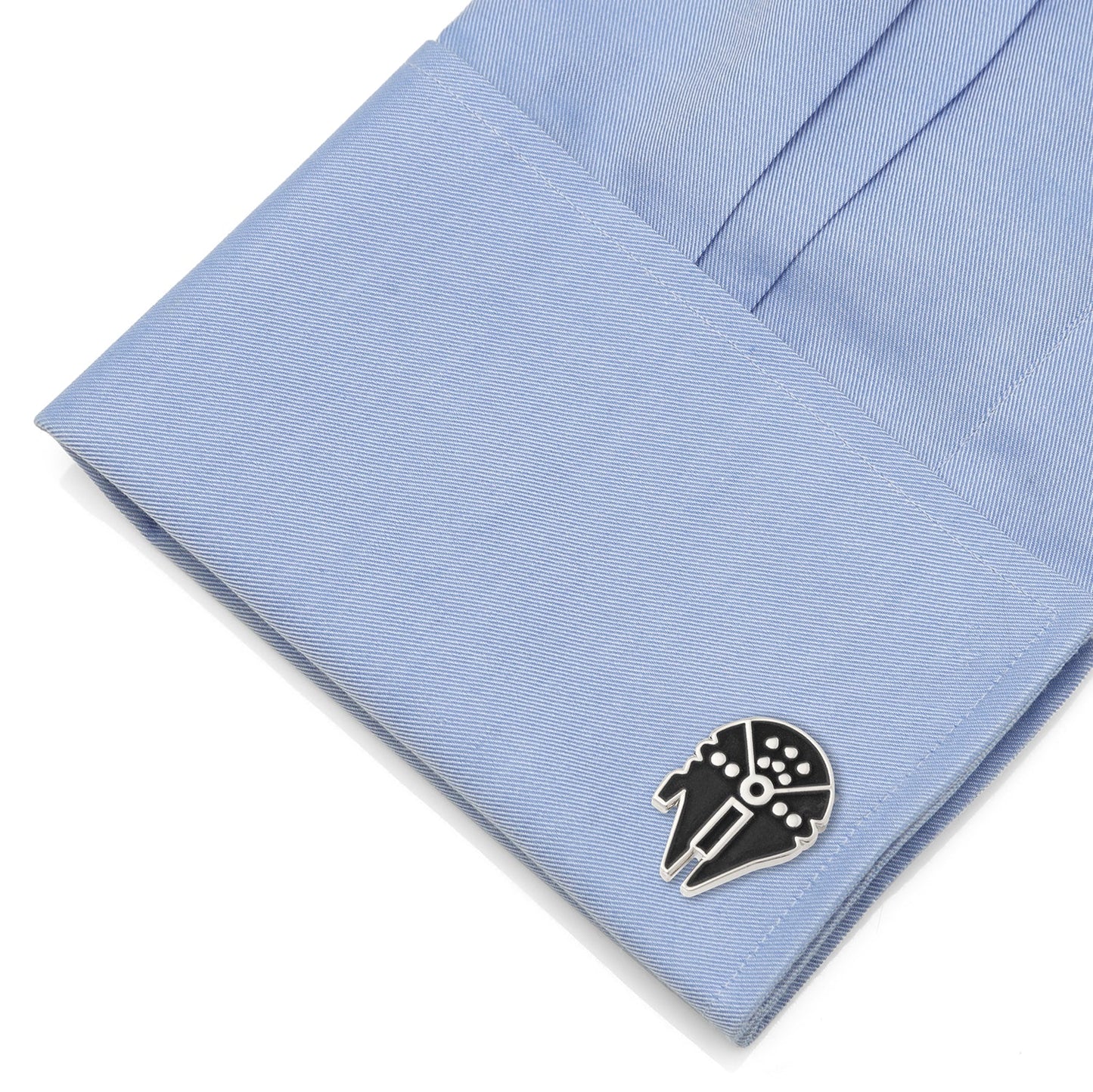 Cufflink on a blue shirt cuff