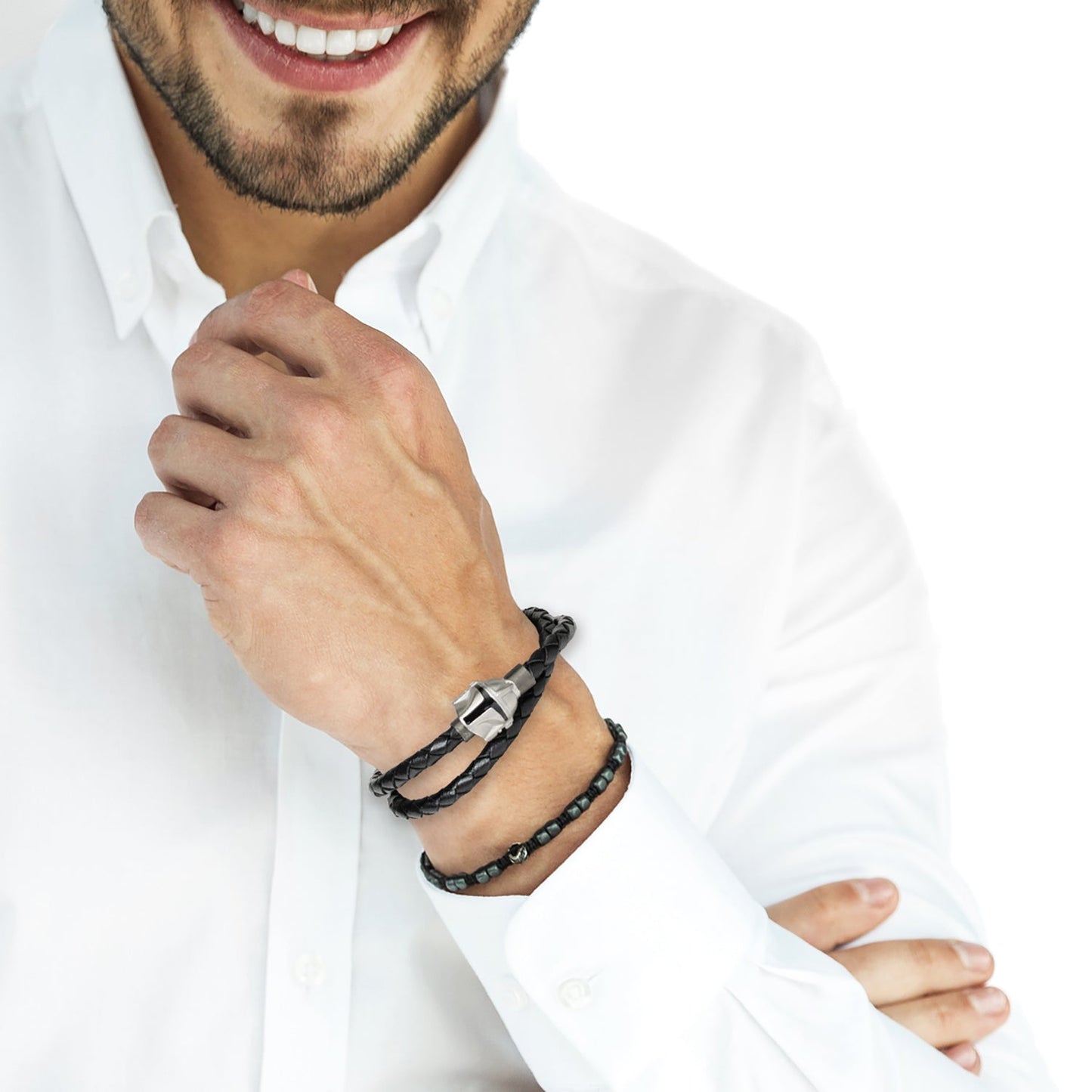 Man wearing a black leather bracelet on a white background