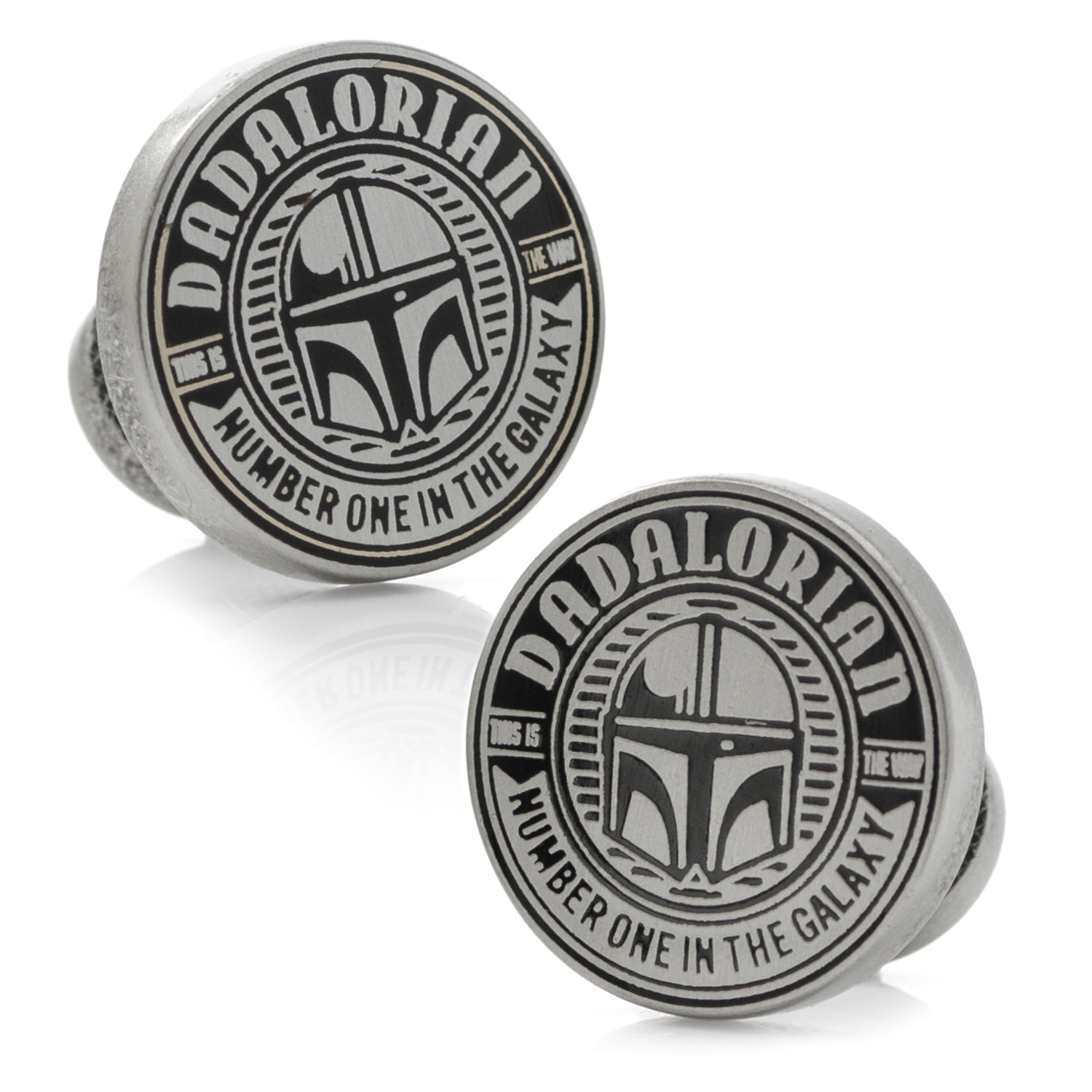Two round metal objects with 'Dadalorian' text and helmet design on a white background