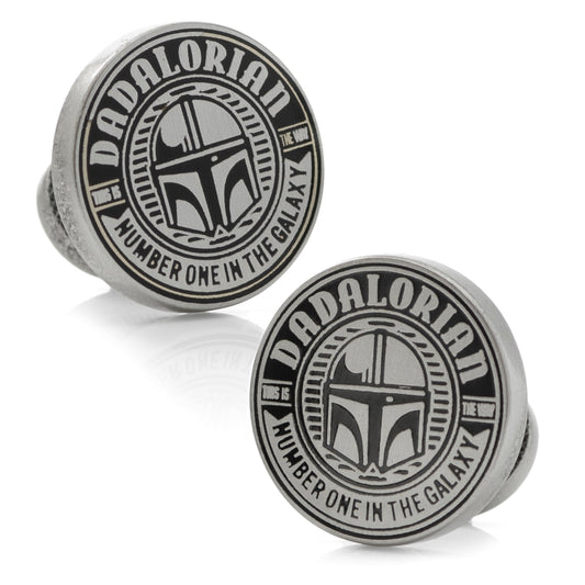 Two round metal objects with 'Dadalorian' text and helmet design on a white background