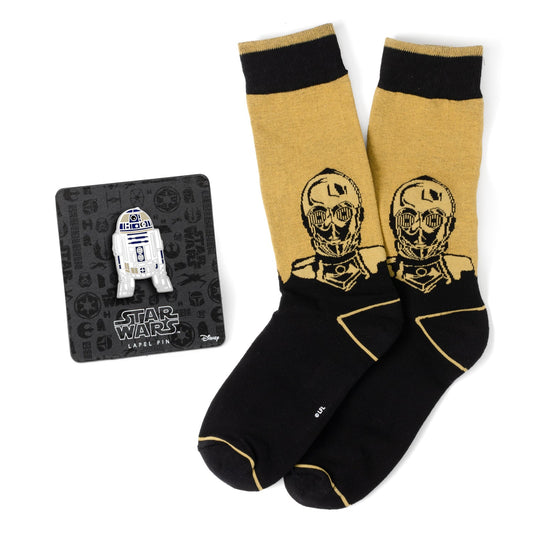 Pair of socks with Star Wars design and a lapel pin on a white background