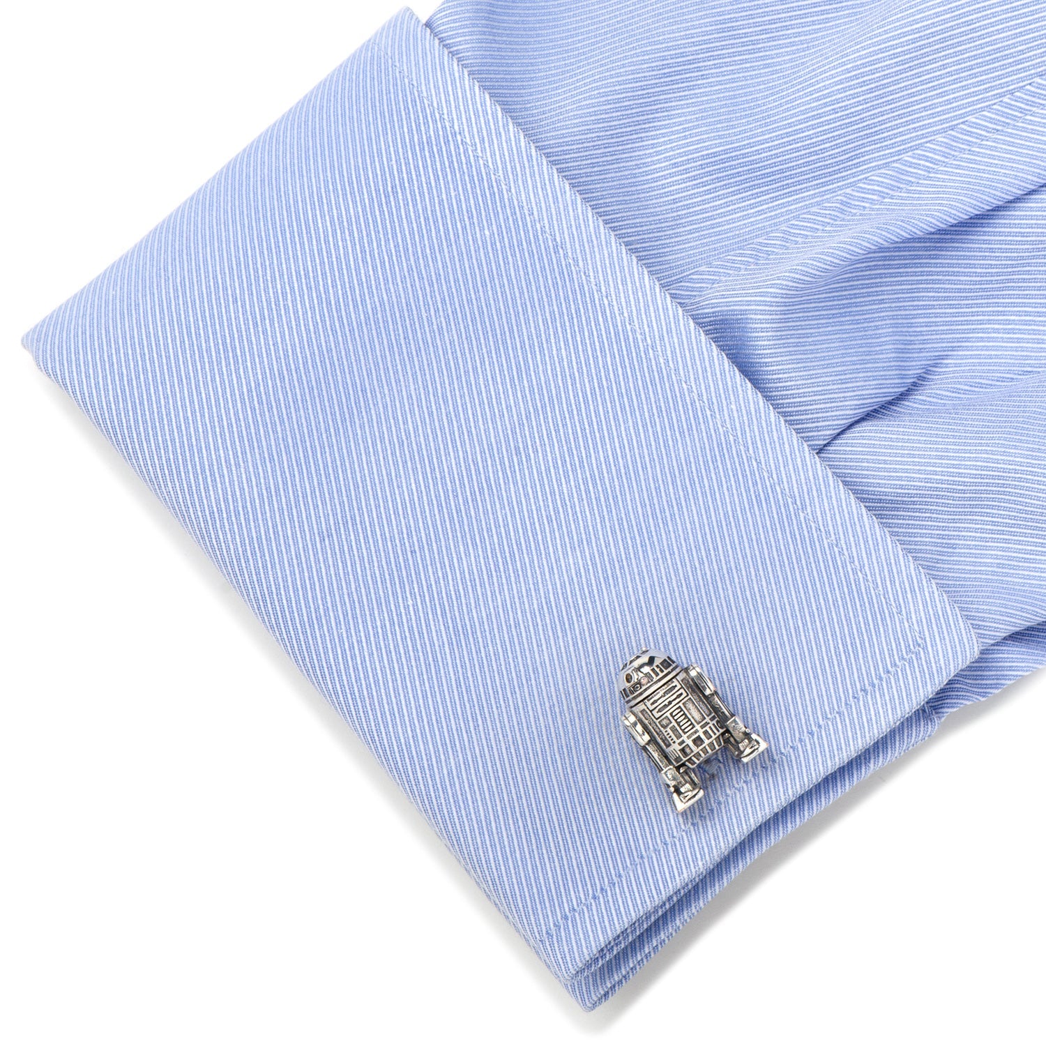 Silver robot cufflink on a light blue striped shirt