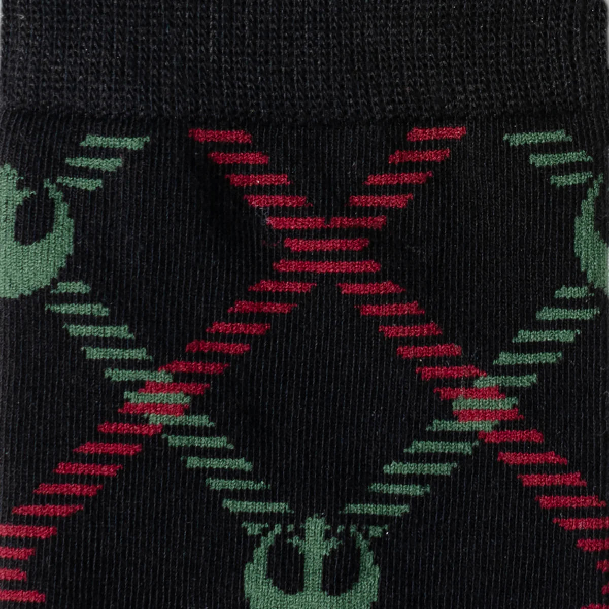 Black socks with red and green abstract patterns