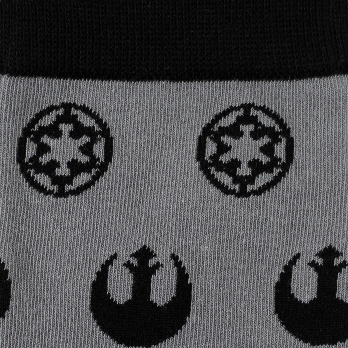 Gray socks with black logos of the Galactic Empire and Rebel Alliance on a black background