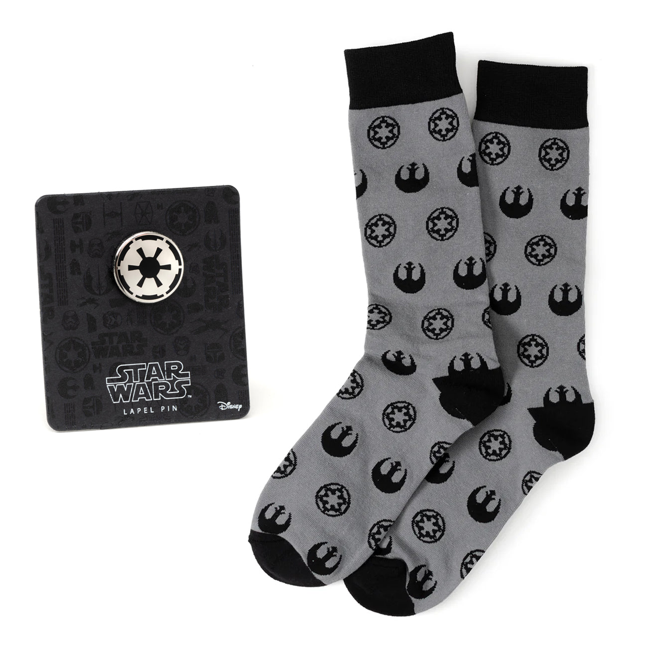 Gray socks with black symbols and a black pin with Star Wars logo on a white background