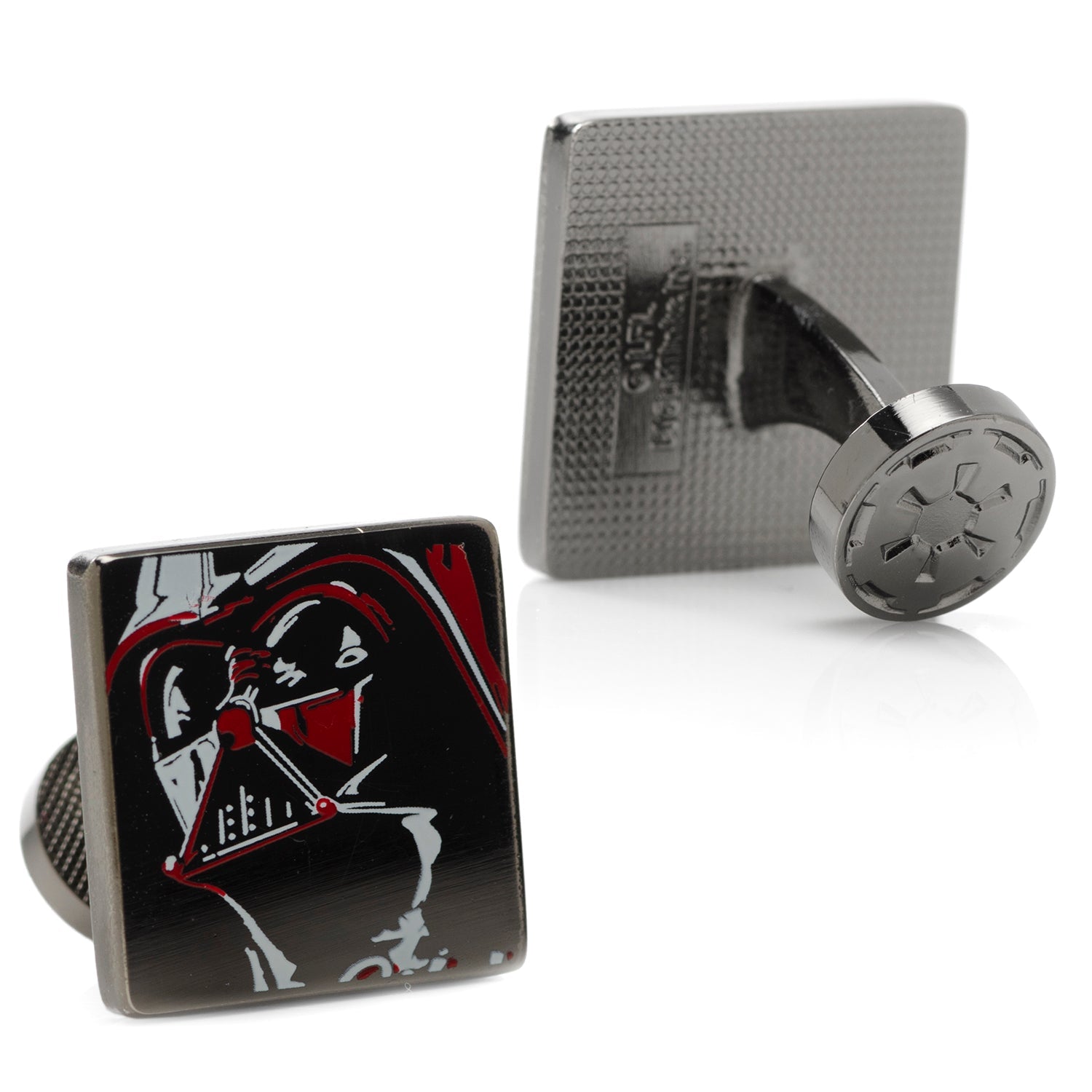 Cufflinks with a design of a character holding a lightsaber on a black background, displayed against a white background.