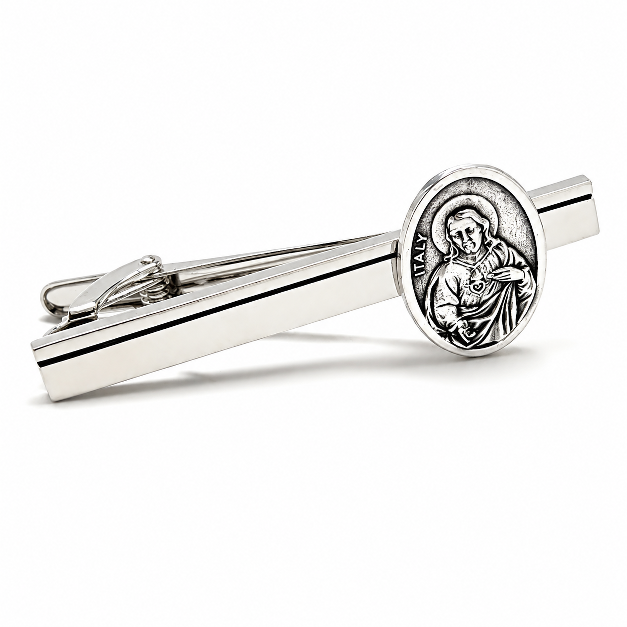 Silver Sacred Heart of Jesus tie clip for men with black accent stripe on white background