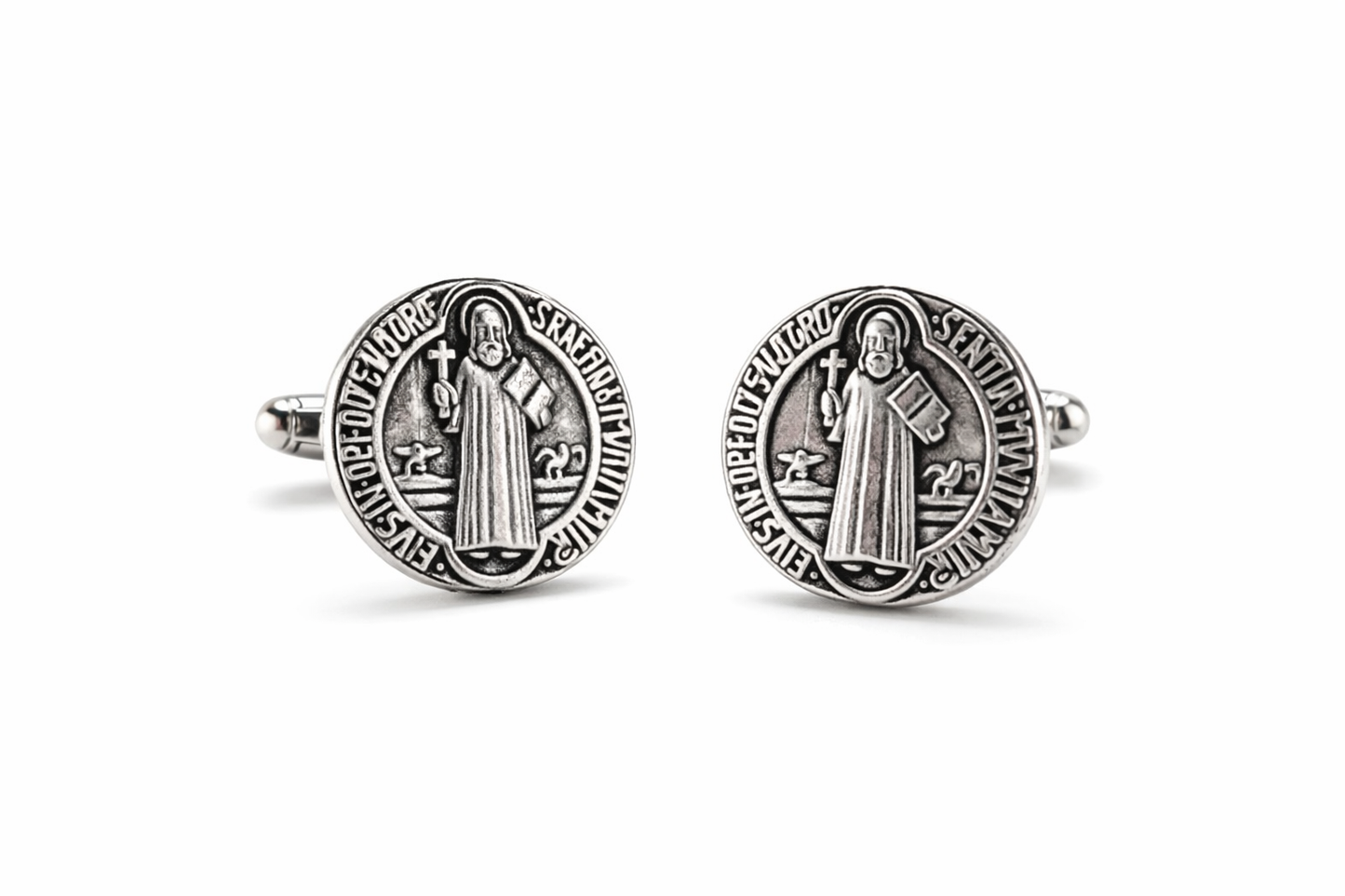 Silver Saint Benedict cufflinks on a white background
