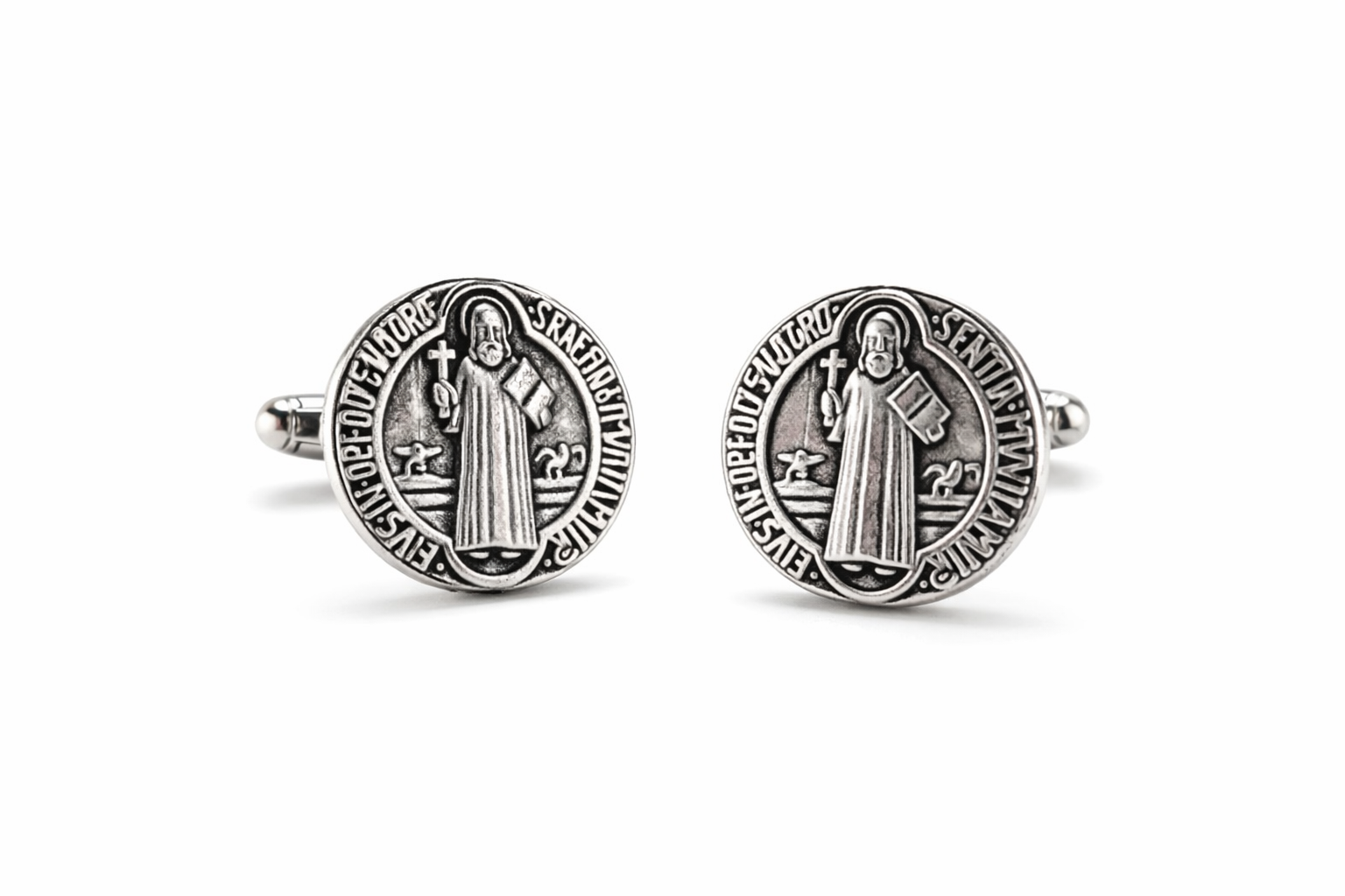 Silver Saint Benedict cufflinks on a white background