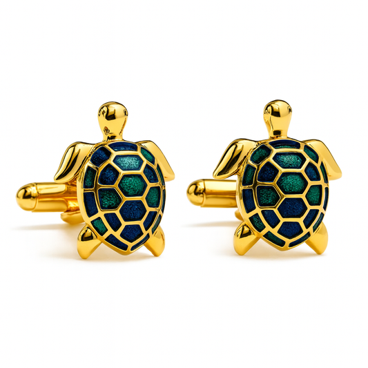 Gold turtle-shaped cufflinks with green and blue design on a white background