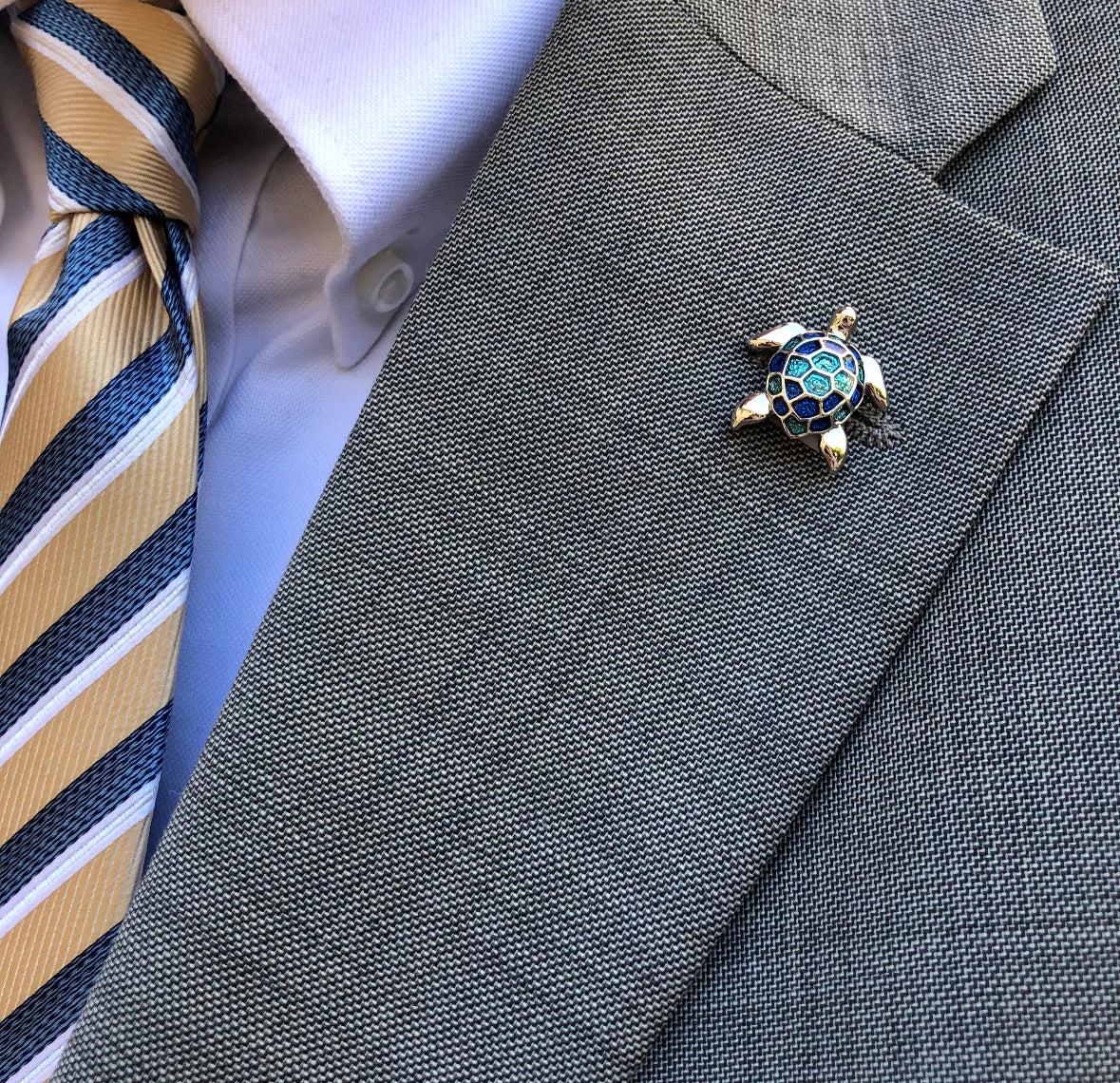 Sea Turtle Pin Magnet on gray suite