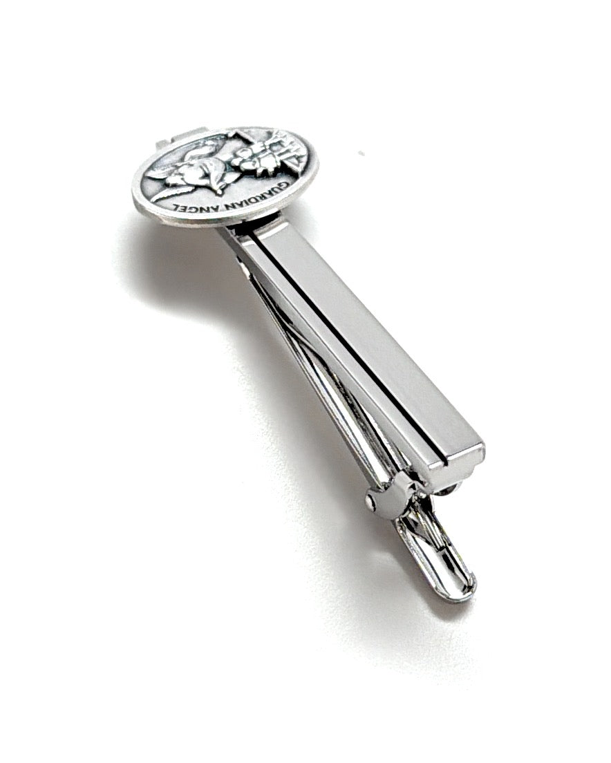 Silver tie clip with star design on a white background