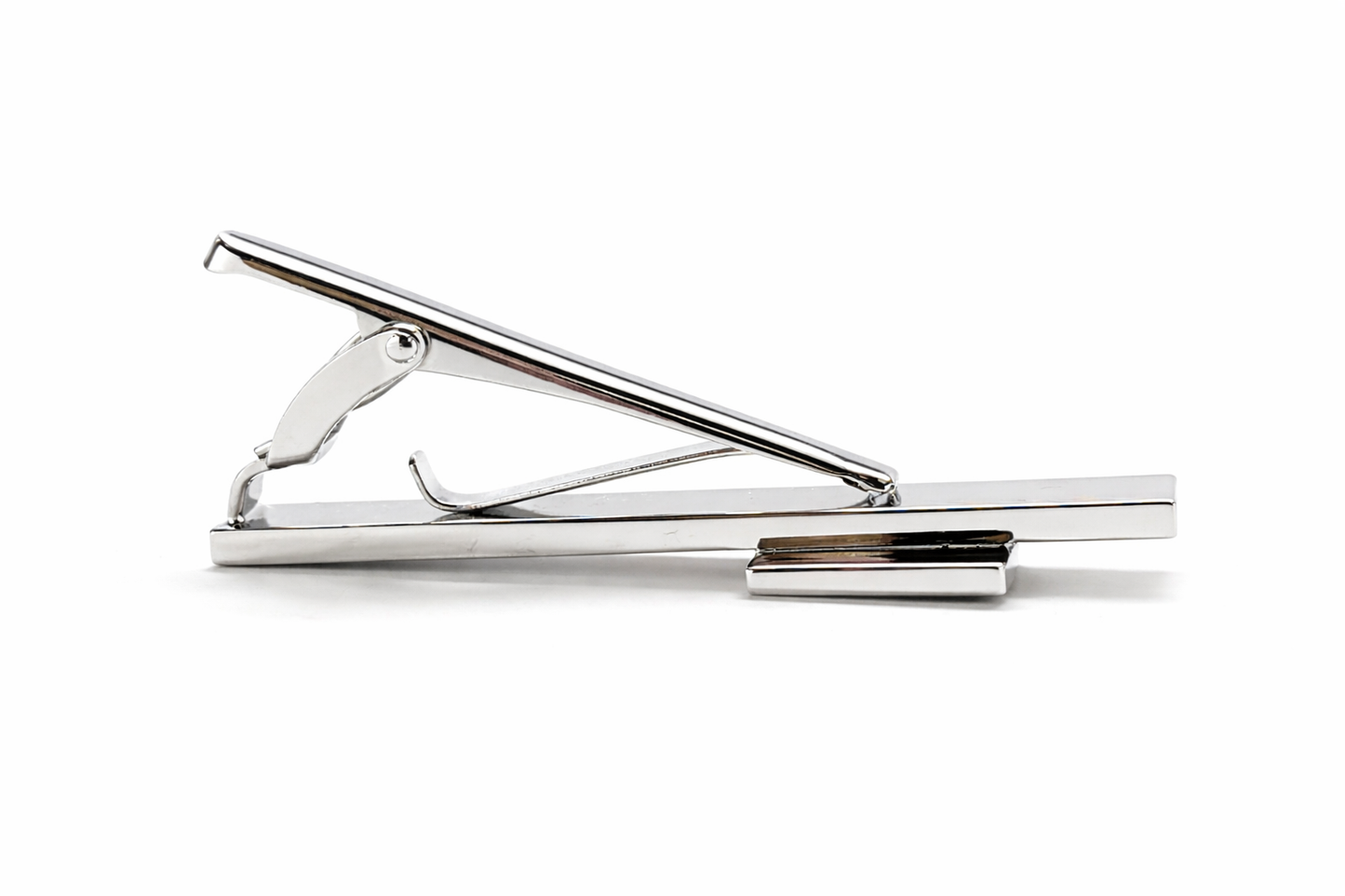 Metallic tie clip on a white background