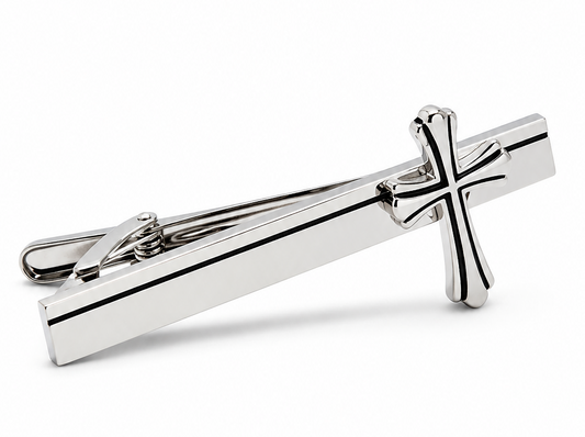 Silver cross tie clip on a white background
