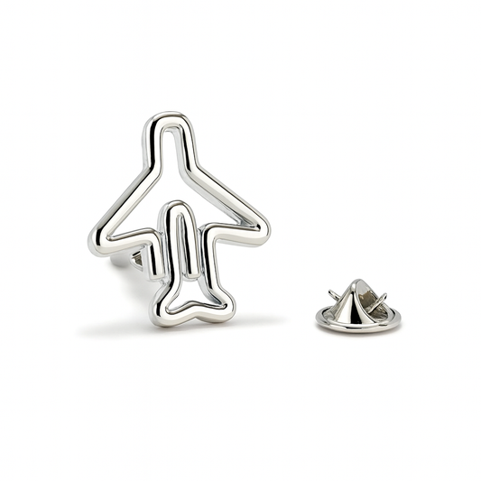 Silver airplane-shaped lapel pin on a white background