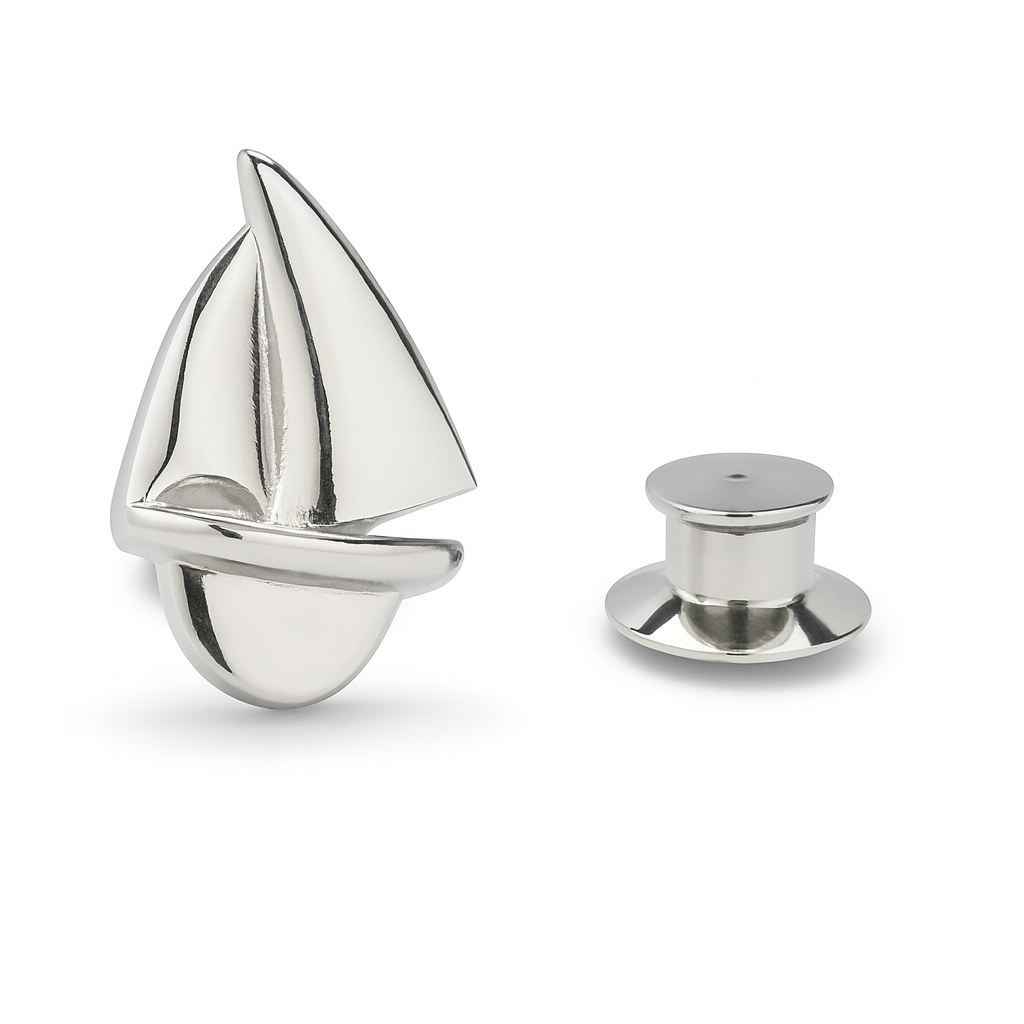 Silver sailboat-shaped object on a white background