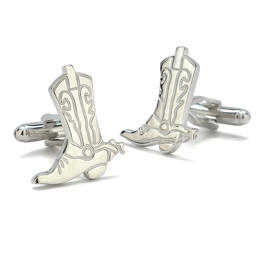 Silver cowboy boot cufflinks on a white background
