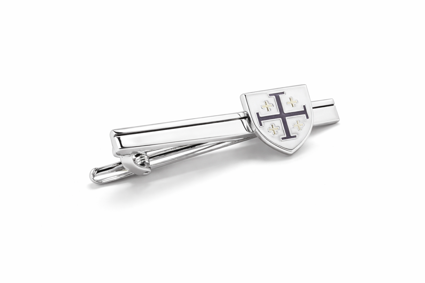 Silver tie clip with a shield design on a white background
