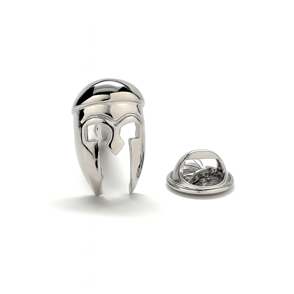 Silver helmet-shaped lapel pin on a white background