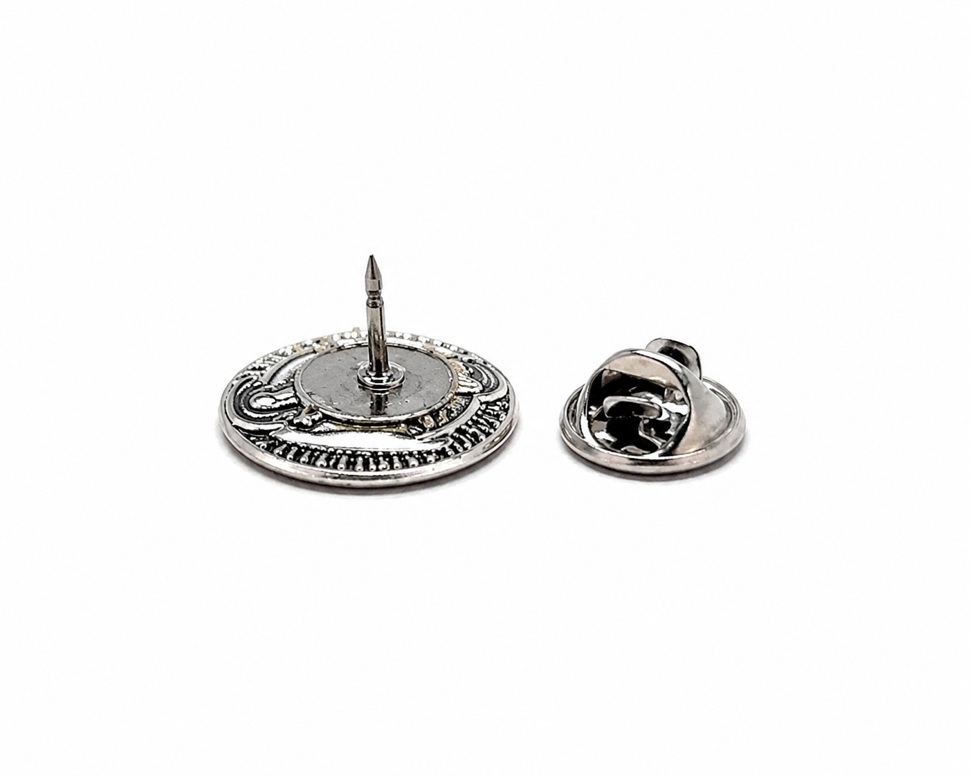Silver lapel pin and earring set on a white background