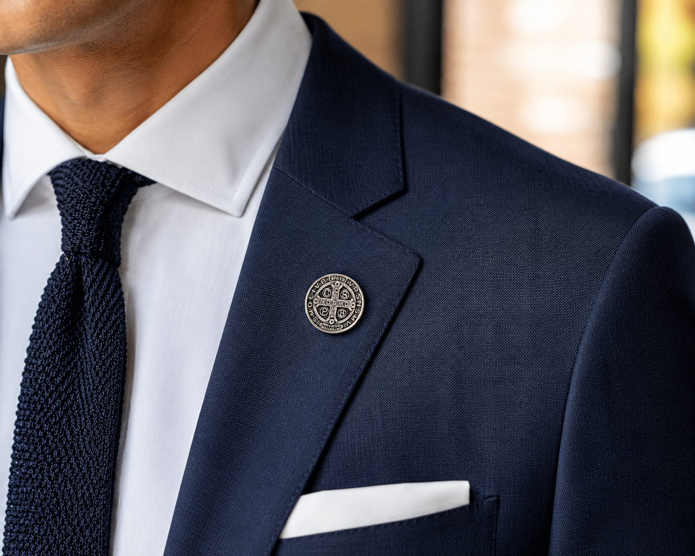 Navy suit jacket with a decorative pin on a blurred background Saint Benedict Medal Lapel Pin Silver Catholic Christian Religious Faith Pin for Men